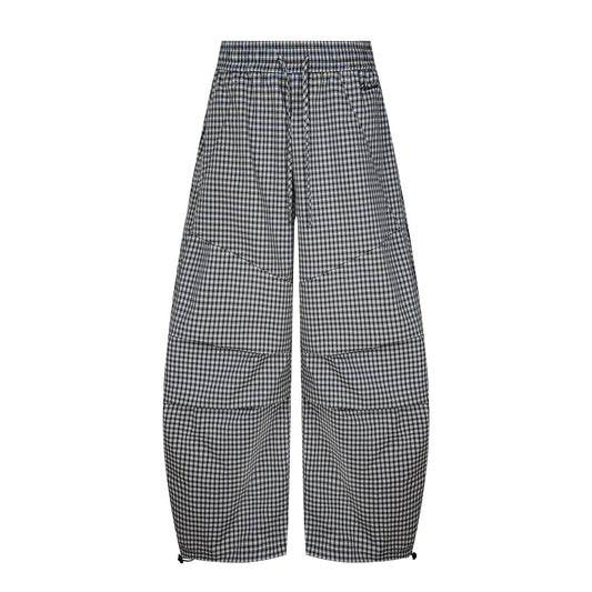 Woman wearing plaid wide leg pants in a casual setting