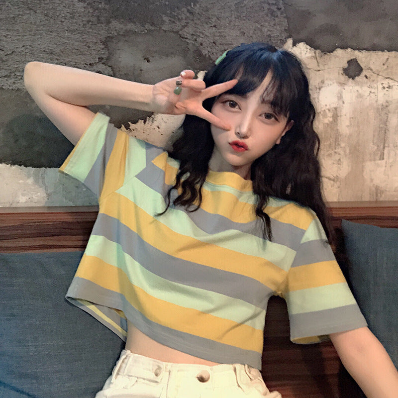 Woman wearing Loose Rainbow Striped Crop Top in a sunny park