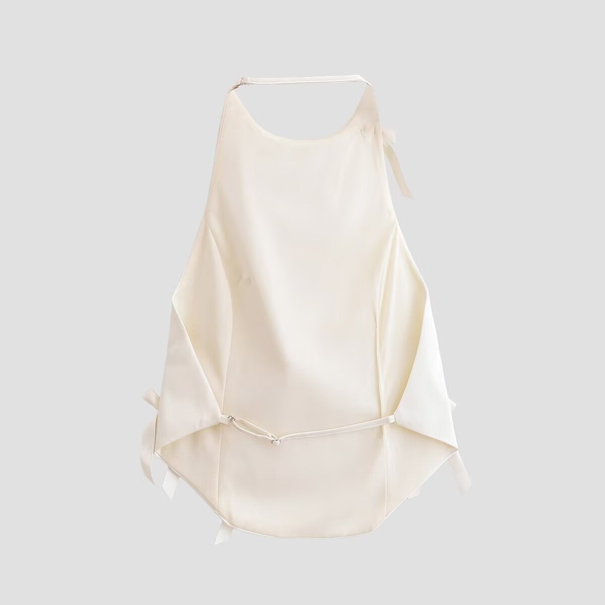 Woman wearing Spicy Girl Bow Decoration Halter Neck Top in a sunny outdoor setting
