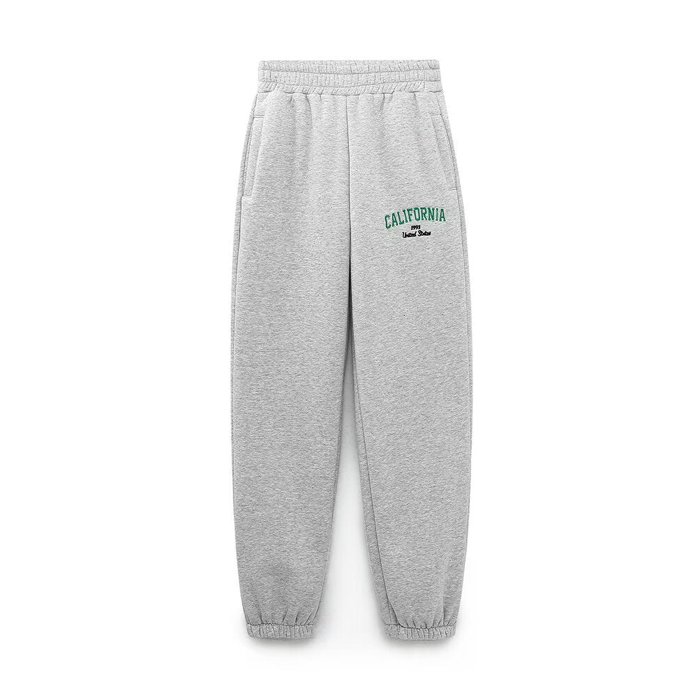Woman wearing Text Embroidered Hoodie and Joggers Set in a casual setting