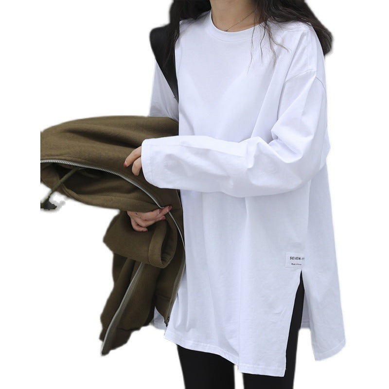 Woman wearing Solid Color Side Slit Long Sleeve T-Shirt in a casual setting
