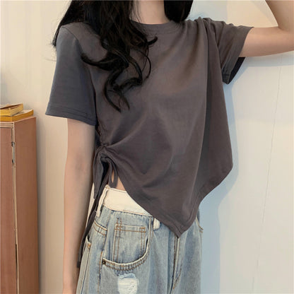 Woman wearing Irregular Drawstring Cropped T-Shirt in a city setting
