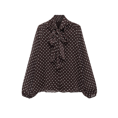 Woman wearing Bow Knot Polka Dot Long Sleeve Shirt in a casual setting
