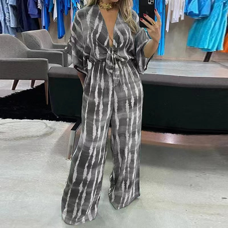 Woman wearing Printed V-Neck Straight Leg Jumpsuit in a casual outdoor setting
