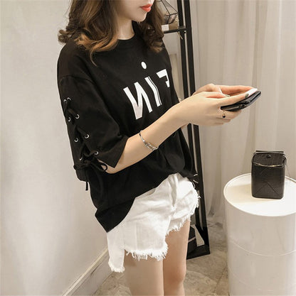 Woman wearing Letter Print Loose Fit T-Shirt in a casual setting