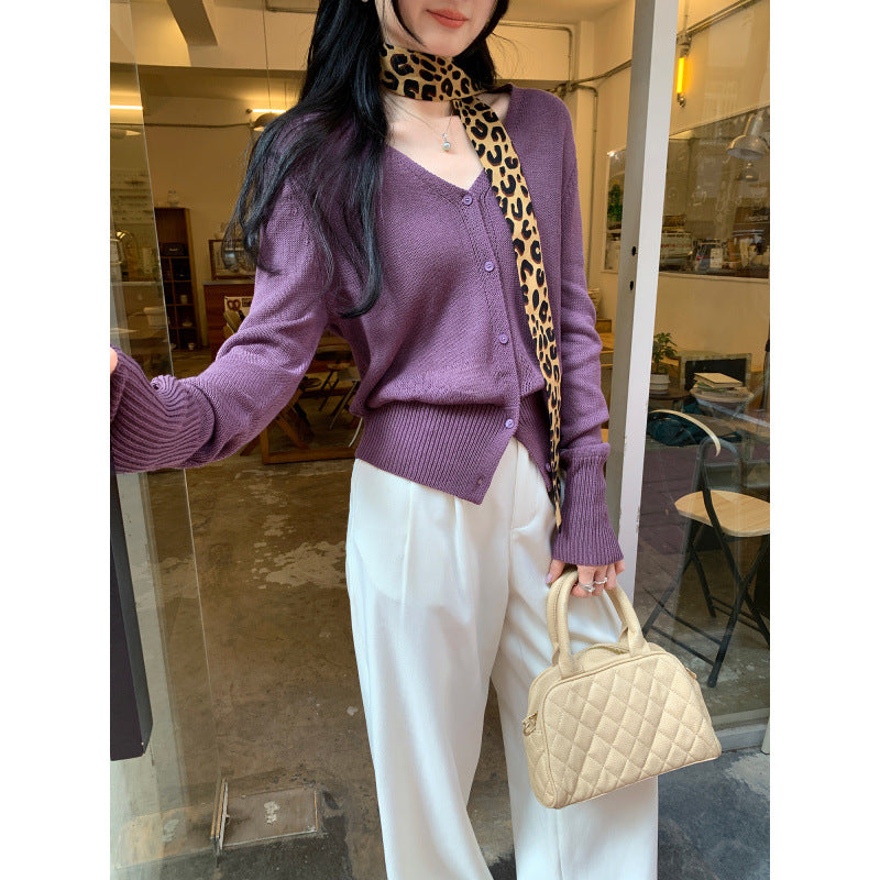 Woman wearing V-Neck Batwing Sleeve Knit Cardigan Coat in a stylish outdoor setting
