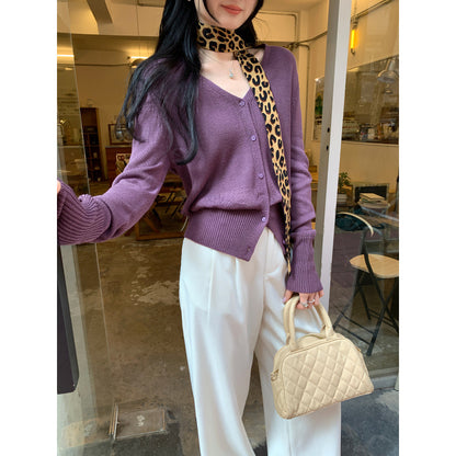 Woman wearing V-Neck Batwing Sleeve Knit Cardigan Coat in a stylish outdoor setting