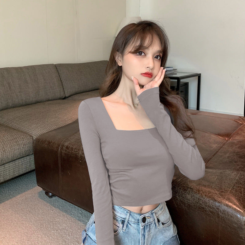 Woman wearing Slim Fit Round Neck Long Sleeve Basic T-Shirt in a casual setting