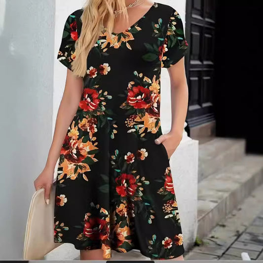 Woman wearing Black Floral A-Line Midi Dress in a garden setting