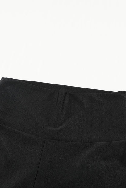 Woman wearing Black High Rise Tight Leggings in a casual setting