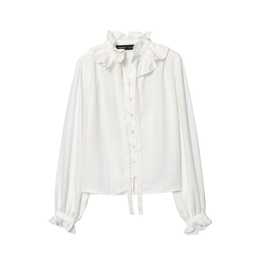 Woman wearing Ruffled Collar Long Sleeve Shirt in a casual setting