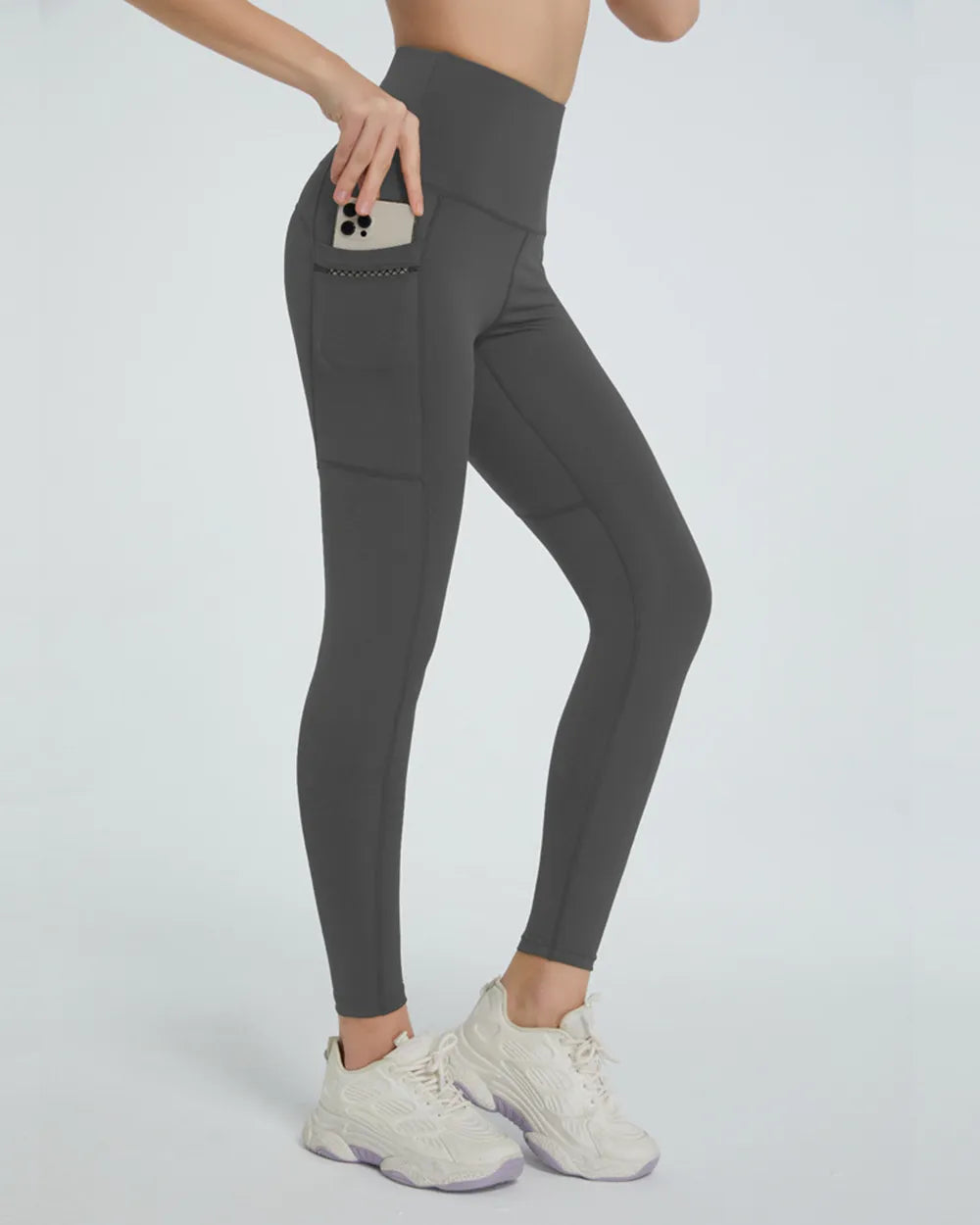 Woman wearing High Waist Active Leggings in a fitness setting