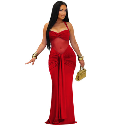 Woman wearing Sheer Mesh Halter Tie-Back Bodycon Dress in a stylish setting