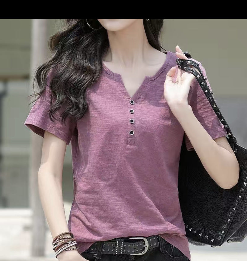 Woman wearing Loose Plus Size V-Neck Short Sleeve Casual T-Shirt in a casual setting