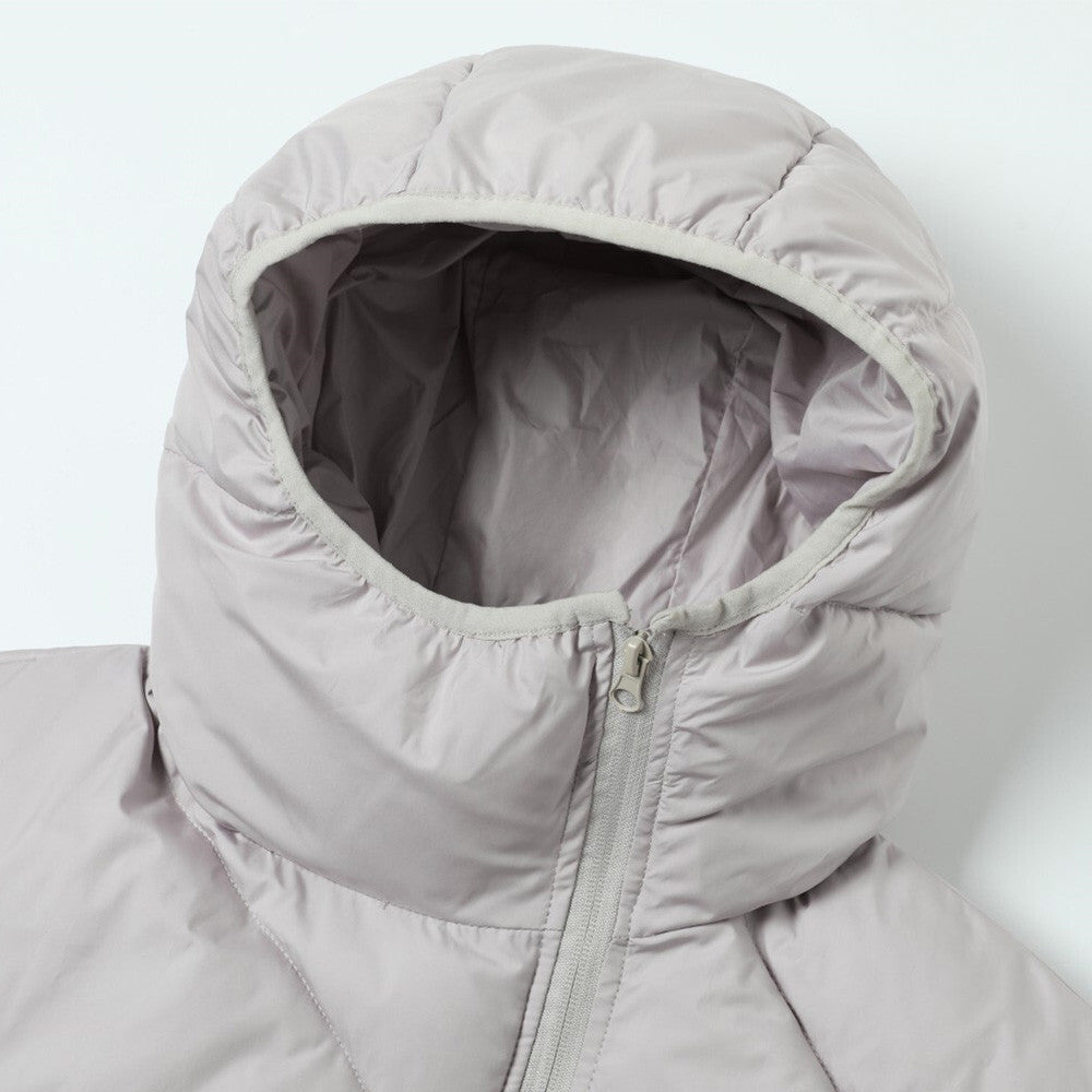 Woman wearing Hooded Loose Fit Thick Down Jacket in a winter setting