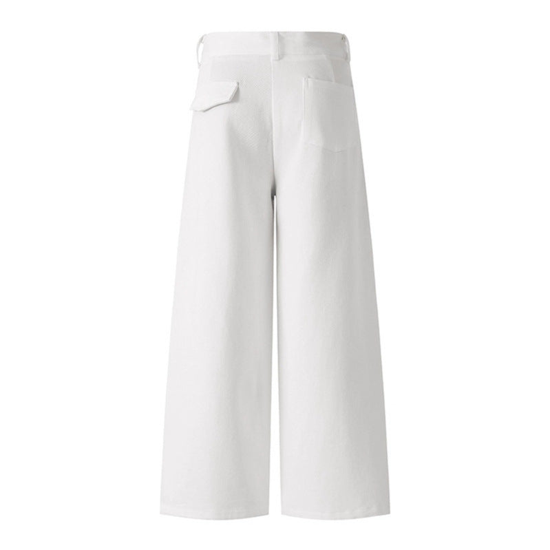 Woman wearing casual white denim pants in a trendy urban setting