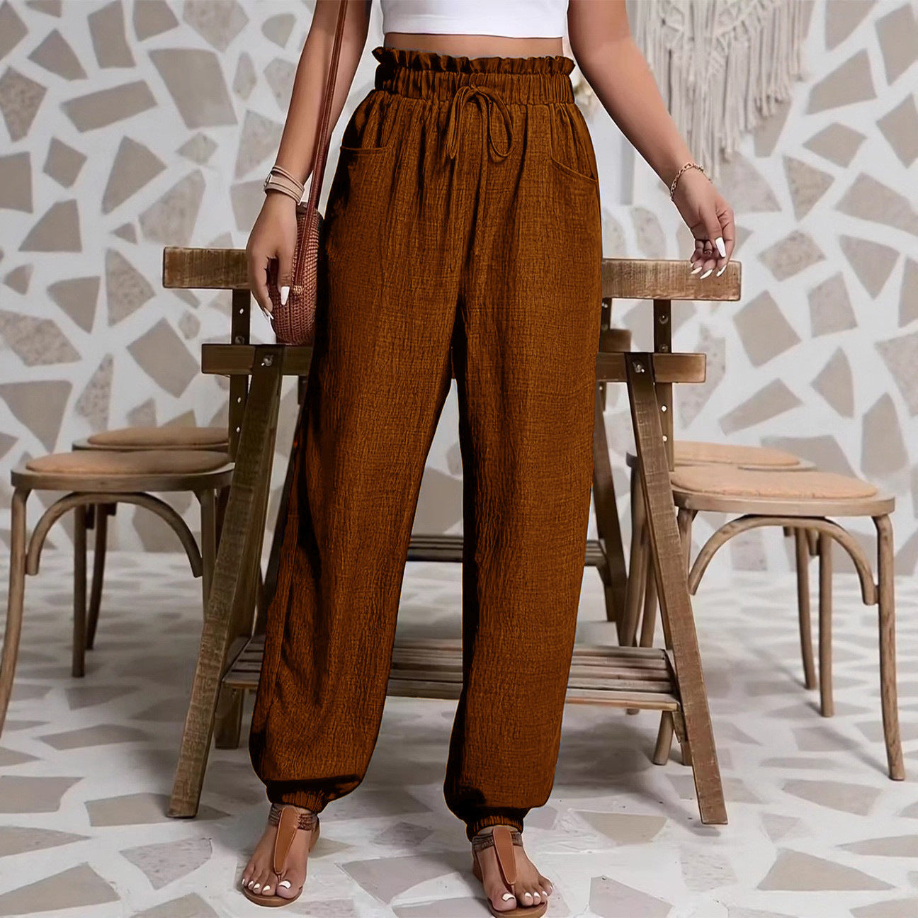 Woman wearing Elastic Solid Color Pants in a casual setting
