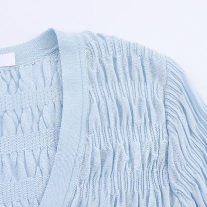 Woman wearing Light Blue Pleated Knitted Jacket in a casual setting