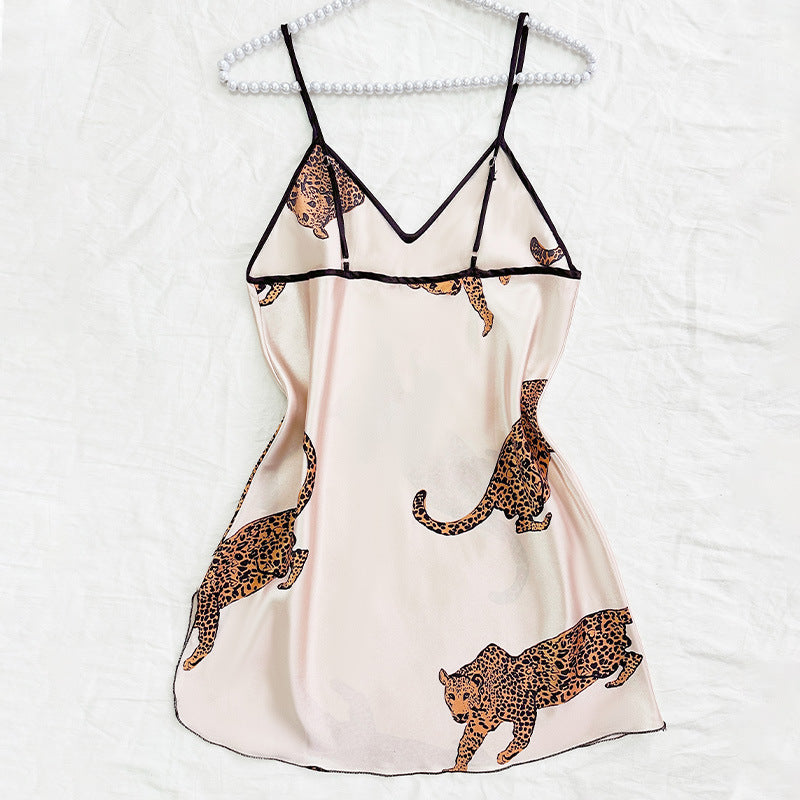 Woman wearing sexy suspender nightgown in a cozy bedroom setting