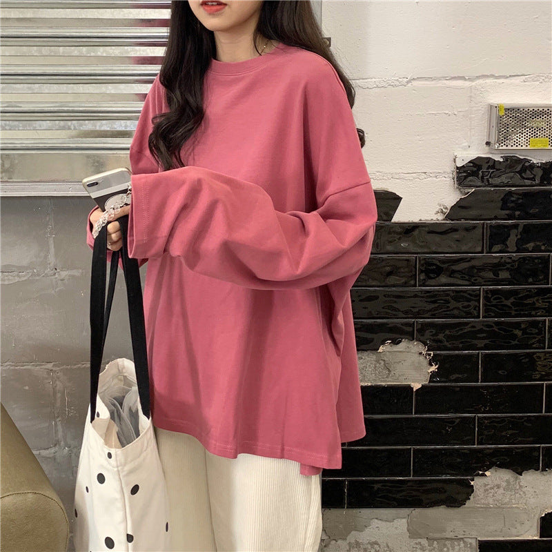 Woman wearing Split Color Long Sleeve T Shirt in a casual setting