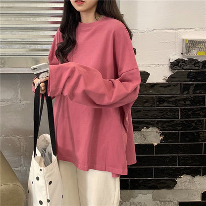 Woman wearing Split Color Long Sleeve T Shirt in a casual setting