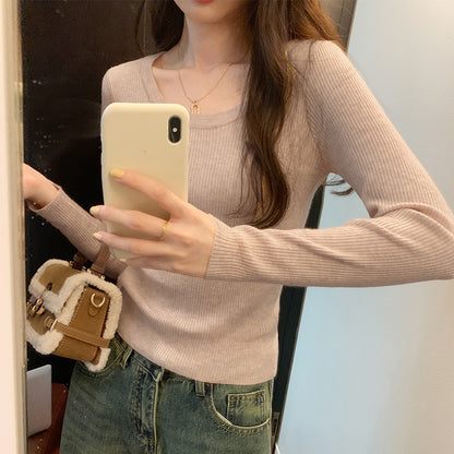 Woman wearing U Neck Long Sleeve Pullover Top in a casual setting