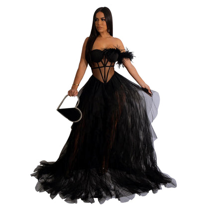 Woman wearing Sleeveless Bustier Mesh Maxi Dress in an elegant evening setting