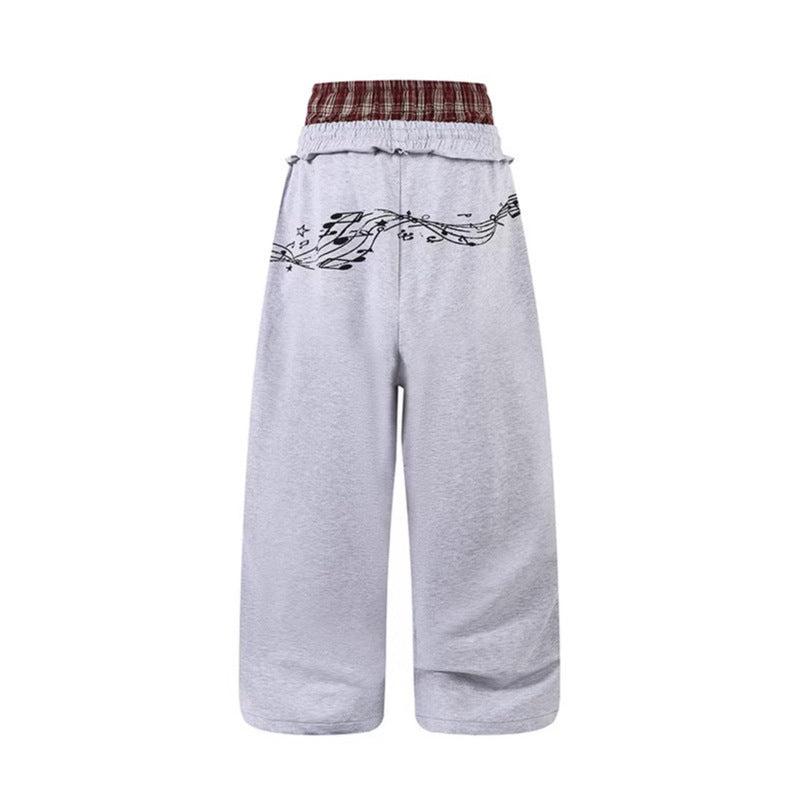 Woman wearing Double Waistband Music Note Graffiti Wide Leg Pants in a casual setting
