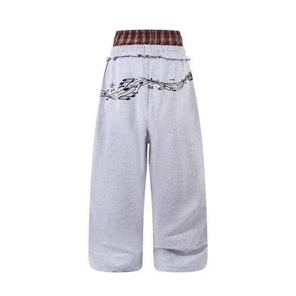 Woman wearing Double Waistband Music Note Graffiti Wide Leg Pants in a casual setting