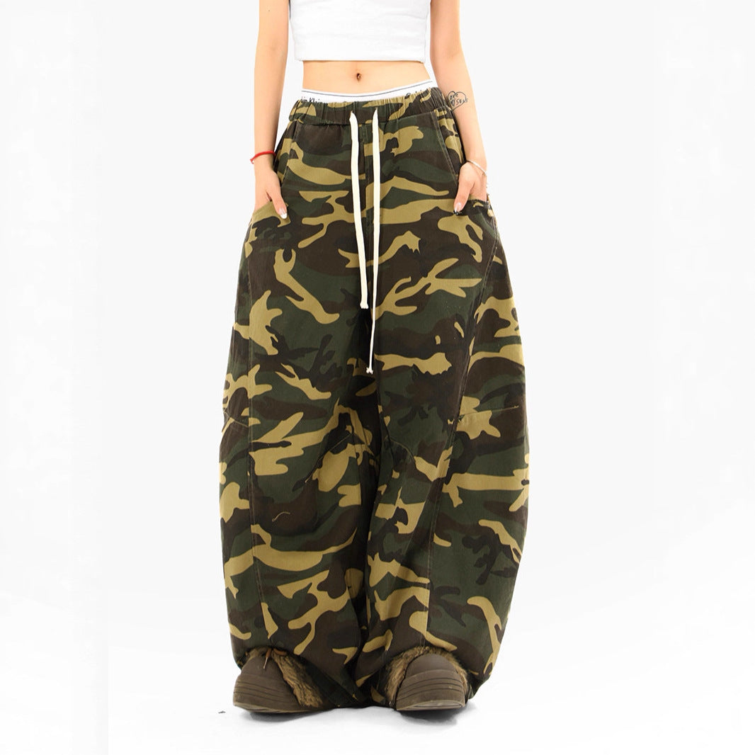 Woman wearing camouflage straight leg casual pants in an urban setting