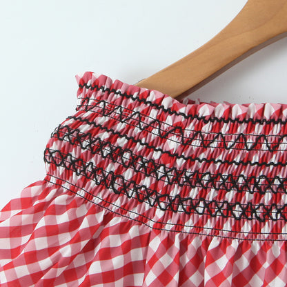 Woman wearing One-Shoulder Red Plaid Midi Dress in a casual setting