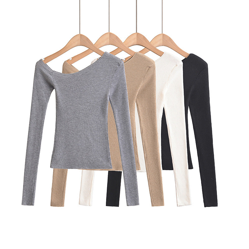 Woman wearing Slanted Shoulder Off Shoulder Slim Fit Top in a casual setting