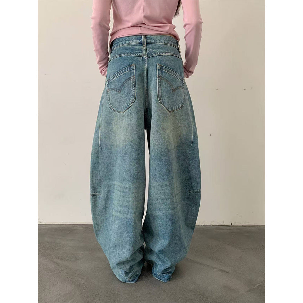 Woman wearing Deconstructed Wide Leg Denim Pants in a city setting