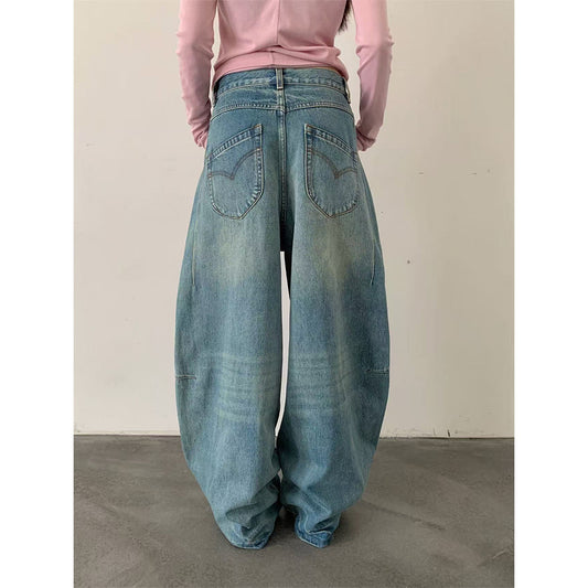 Woman wearing Deconstructed Wide Leg Denim Pants in a city setting