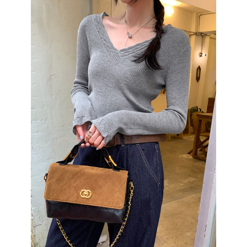 Woman wearing Slim Fit V-Neck Knit Top in a casual setting