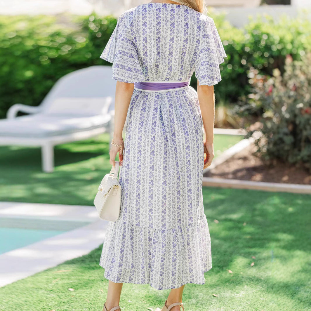 Woman wearing Bohemian Floral Ruffle Maxi Dress in a garden