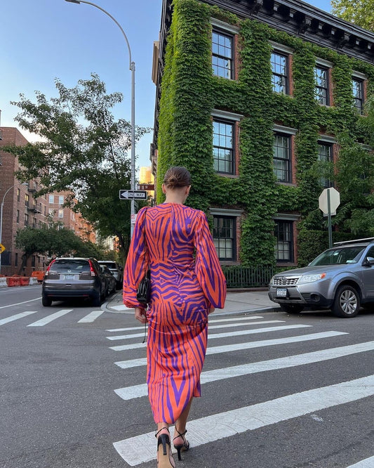 Woman wearing Irregular Stripe Printed Long Dress in a stylish urban setting