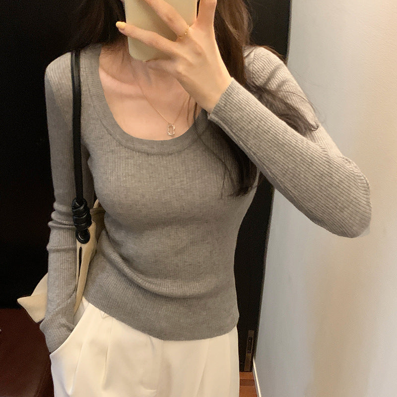 Woman wearing U Neck Long Sleeve Pullover Top in a casual setting