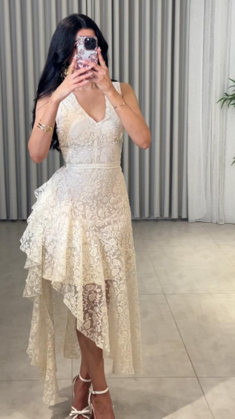 Woman wearing Asymmetric Jacquard Dress in an elegant setting