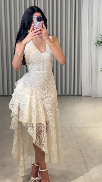 Woman wearing Asymmetric Jacquard Dress in an elegant setting