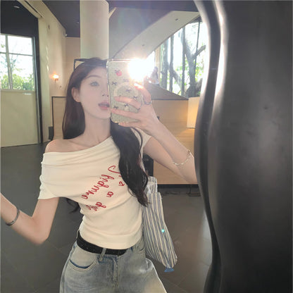 Woman wearing One Shoulder Fitted Crop Top in a casual setting
