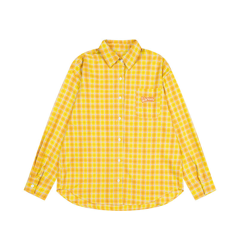 Woman wearing Embroidered Letter Plaid Shirt in a casual outdoor setting