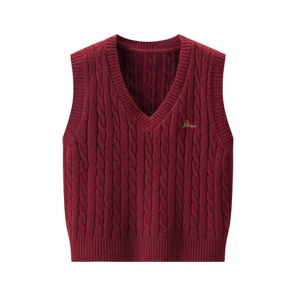 Woman wearing V-Neck Cable Knit Sleeveless Vest in a cozy setting