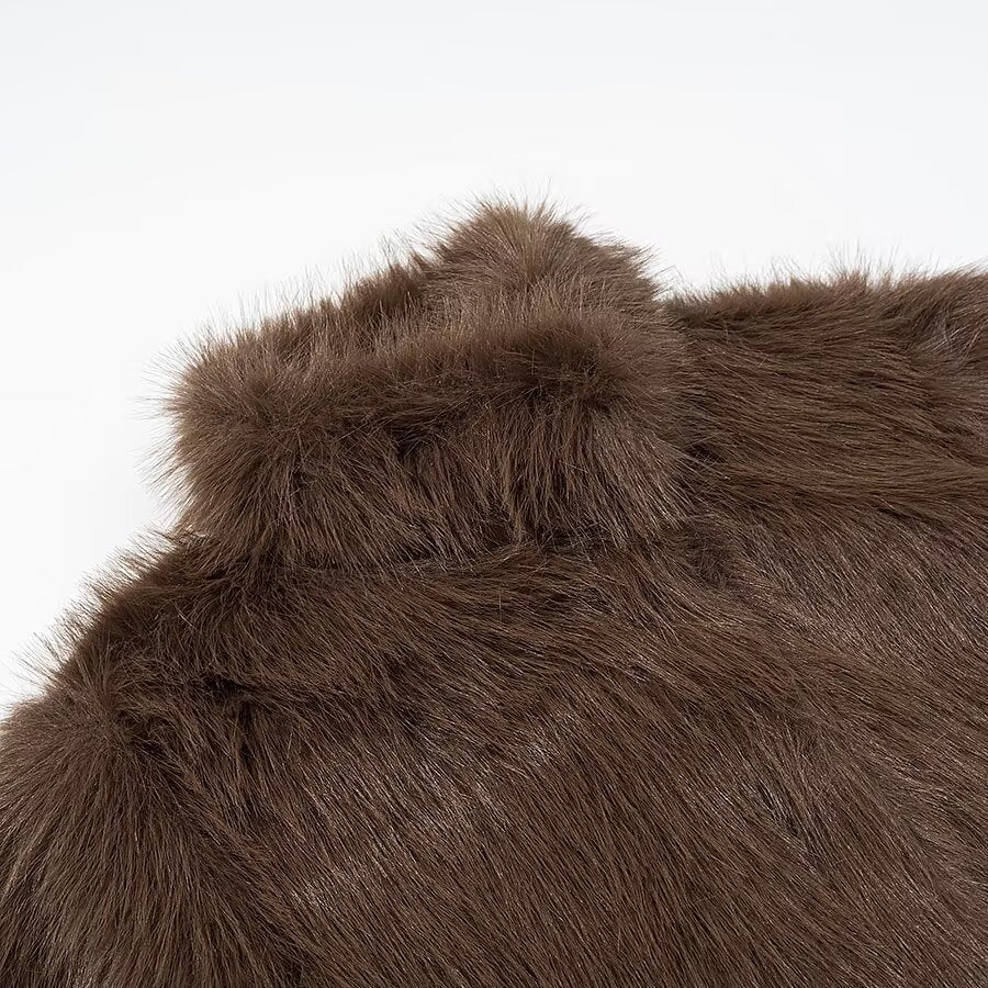 Woman wearing High Neck Long Sleeve Loose Fit Faux Fur Coat in a winter setting