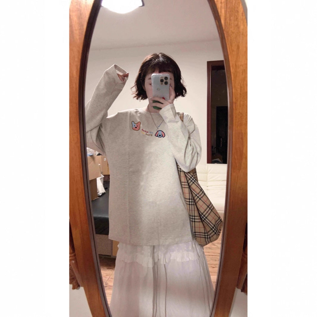 Woman wearing Geometric Pattern Long Sleeve Top in a casual setting