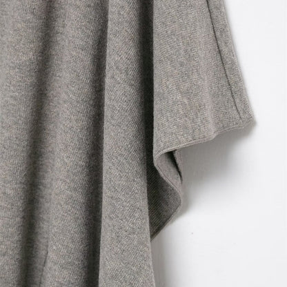 Woman wearing Asymmetric Pleated Midi Skirt in a stylish setting