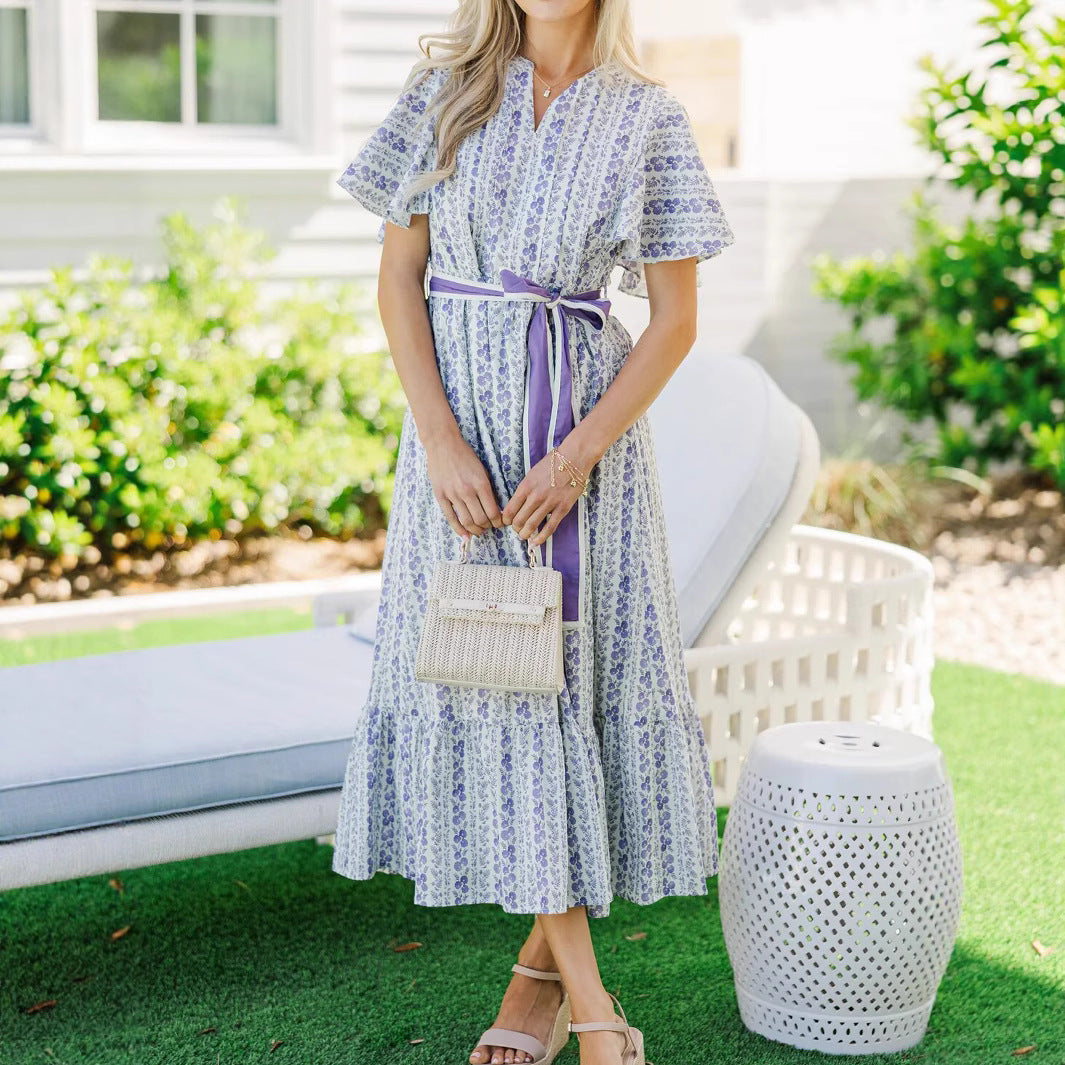 Woman wearing Bohemian Floral Ruffle Maxi Dress in a garden