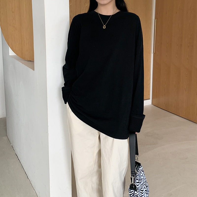 Woman wearing Women's Long Sleeve Loose Fit Basic Tee Top in a casual setting