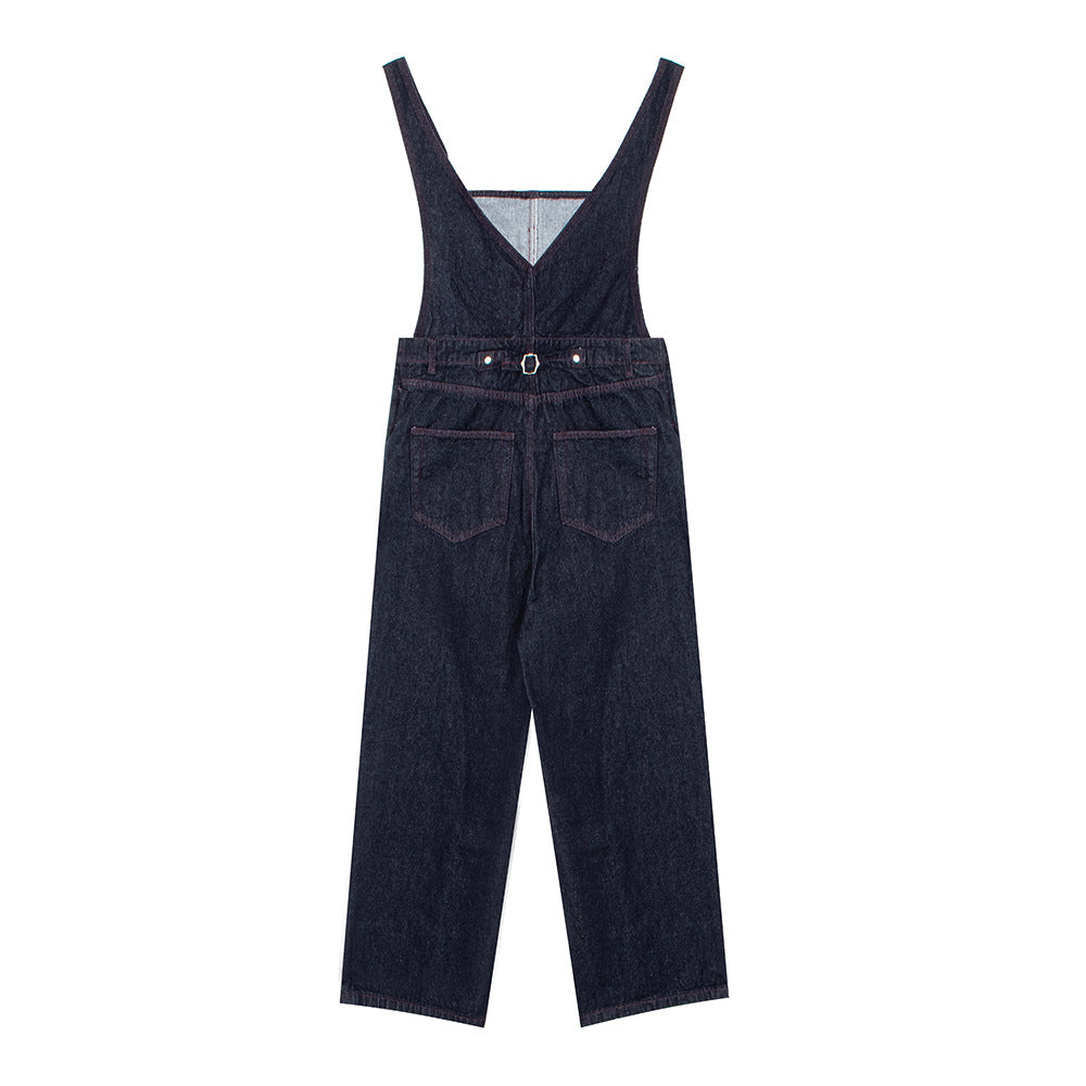Woman wearing Distressed Denim Overalls in a casual outdoor setting