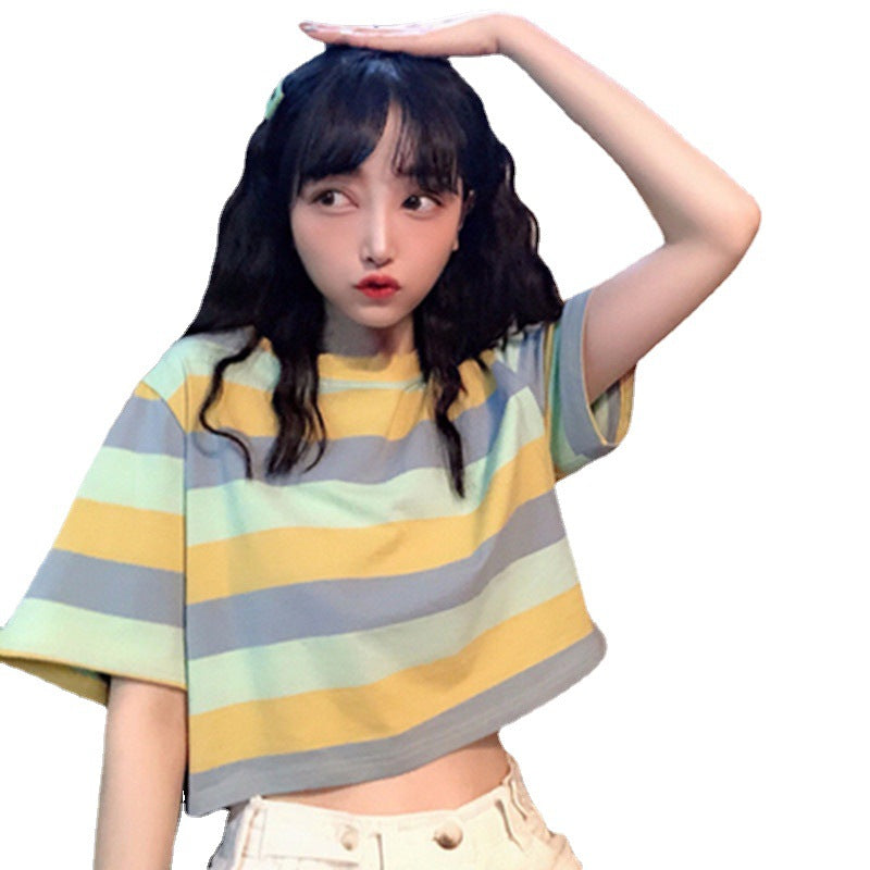 Woman wearing Loose Rainbow Striped Crop Top in a sunny park